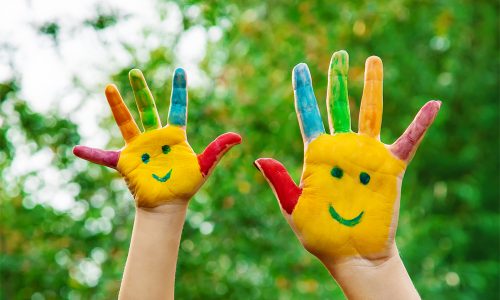 children hands in colors. Summer photo. Selective focus. nature